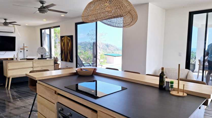 Modern kitchen with ocean view in luxury villa for sale in Samara Costa Rica