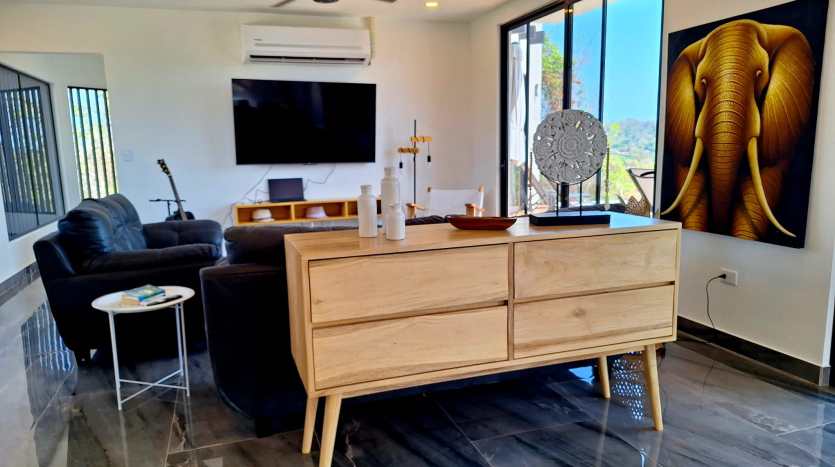 Entertainment living room with TV in luxury ocean view villa for sale in Samara Costa Rica