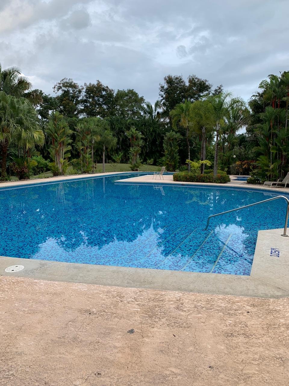 large swimming pool inside loma verde gated community costa rica