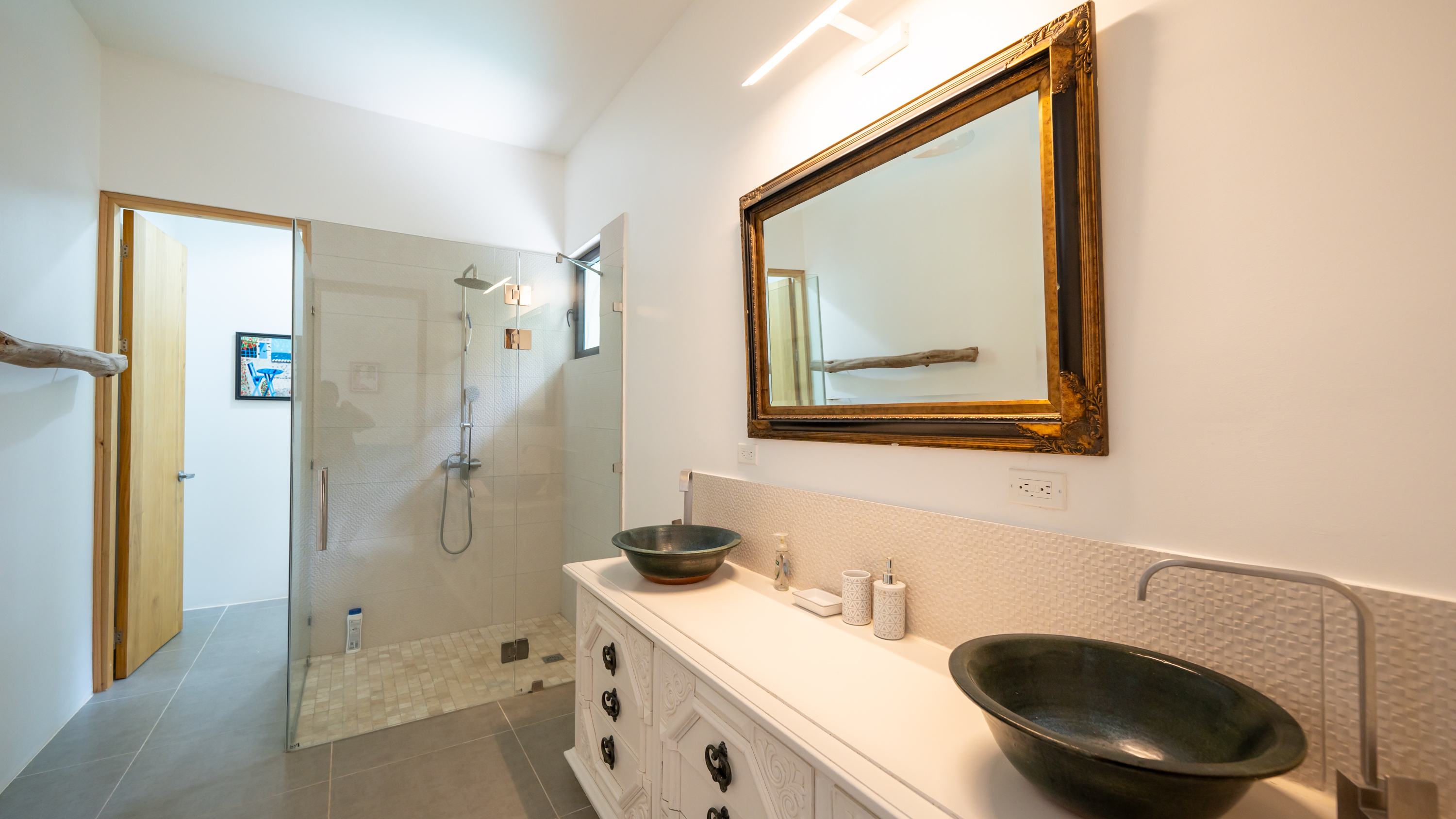 odern luxury bathroom with double sink inside villa for sale samara costa rica