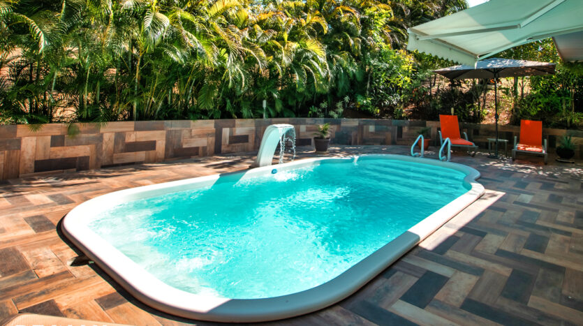 private swimming pool surrounded by tropical garden carrillo costa rica