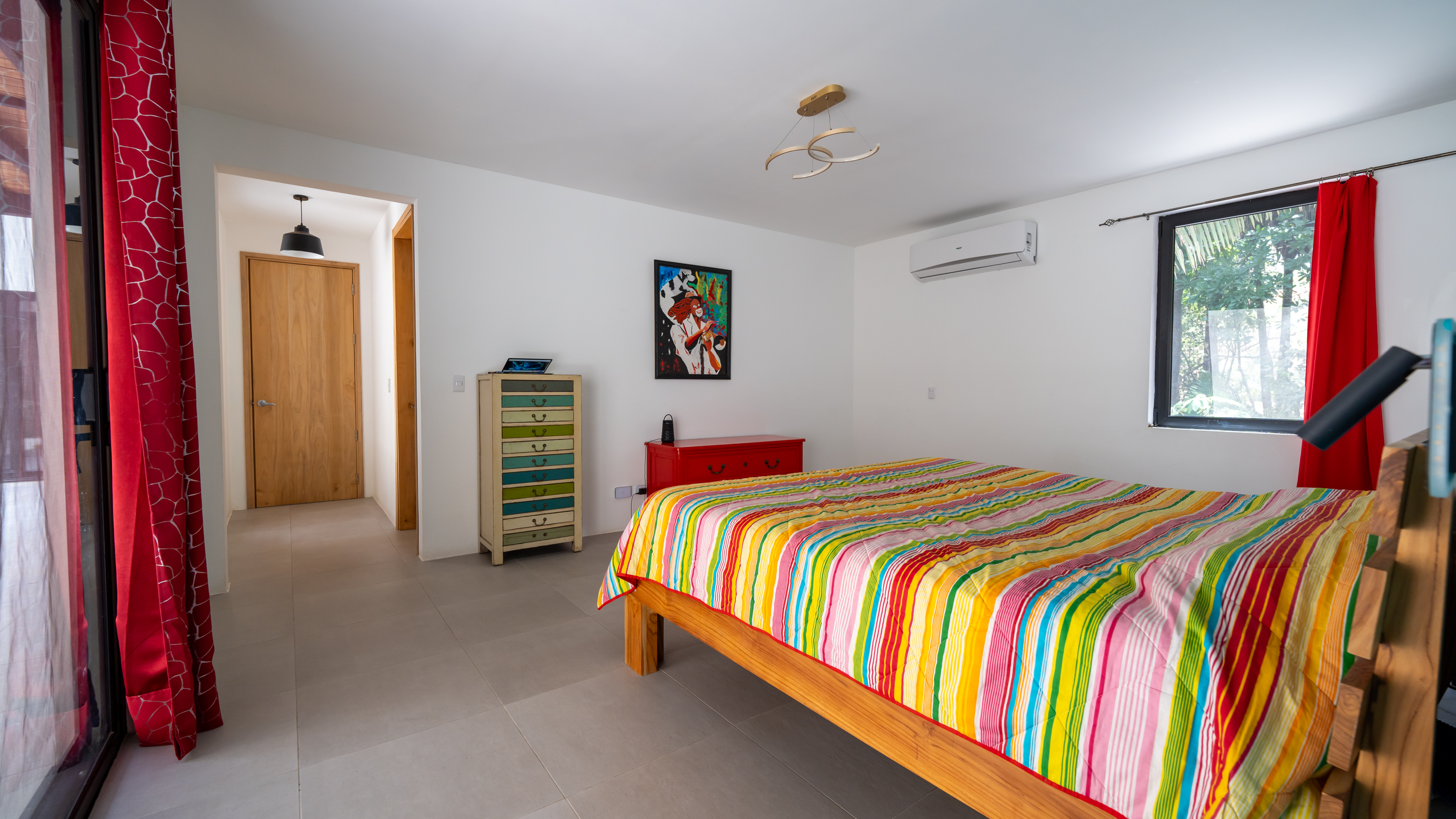 comfortable bedroom inside jungle villa for sale in samara costa rica