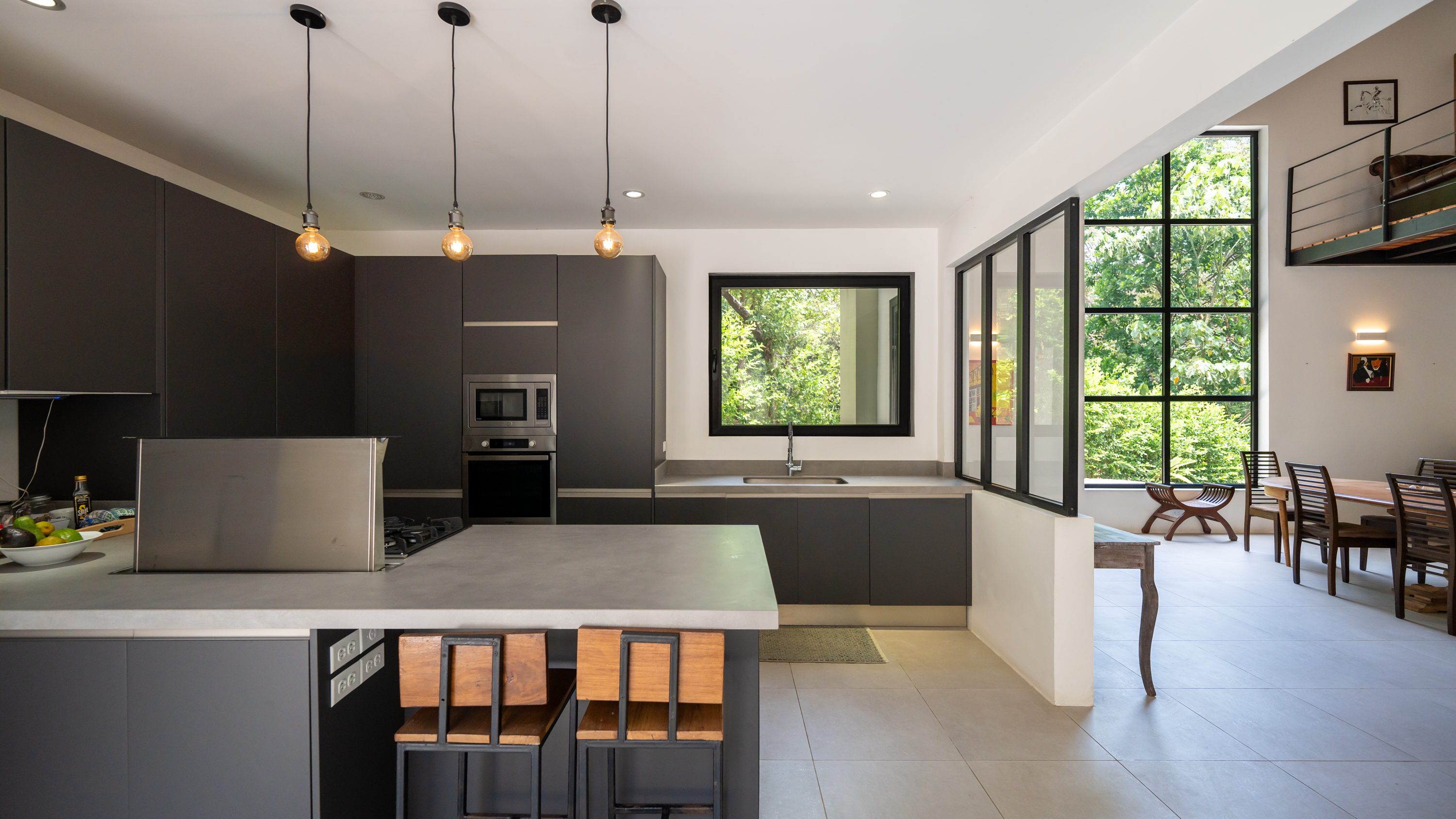 open concept kitchen and living space inside jungle villa samara costa rica