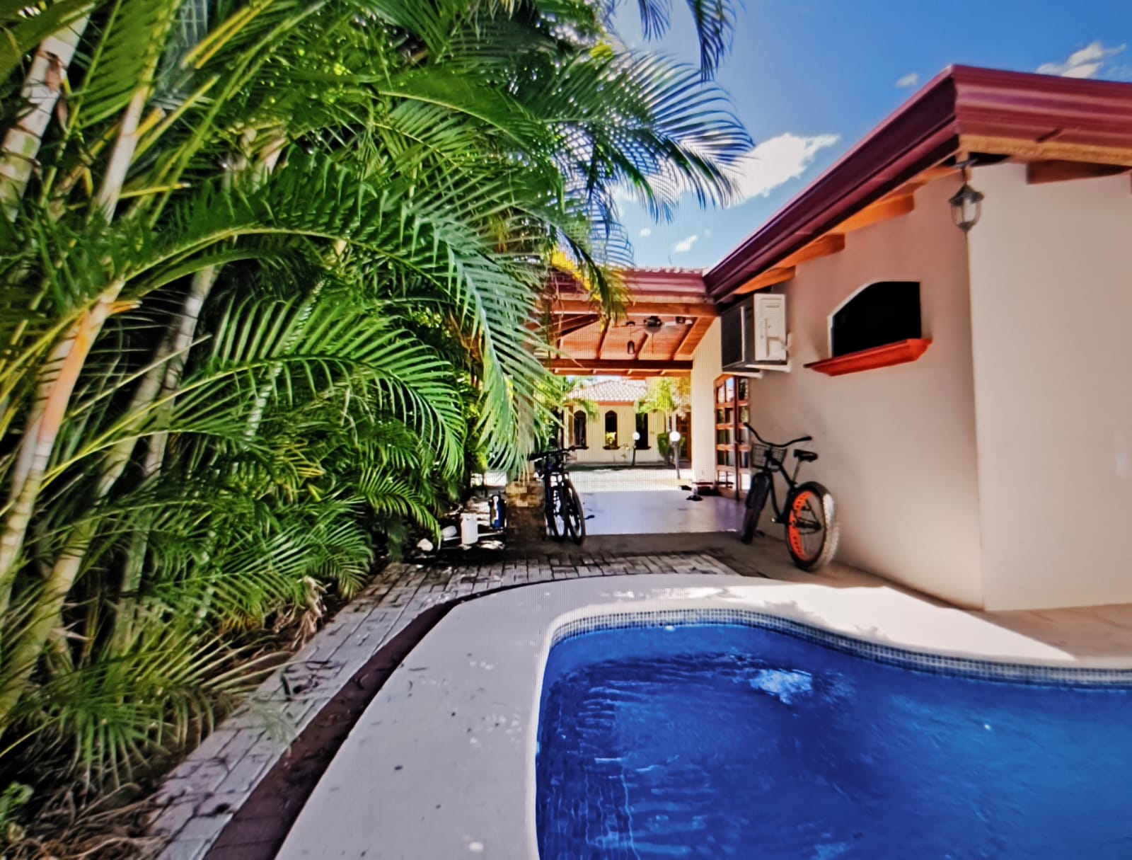 pool surrounded by tropical garden villa serenity