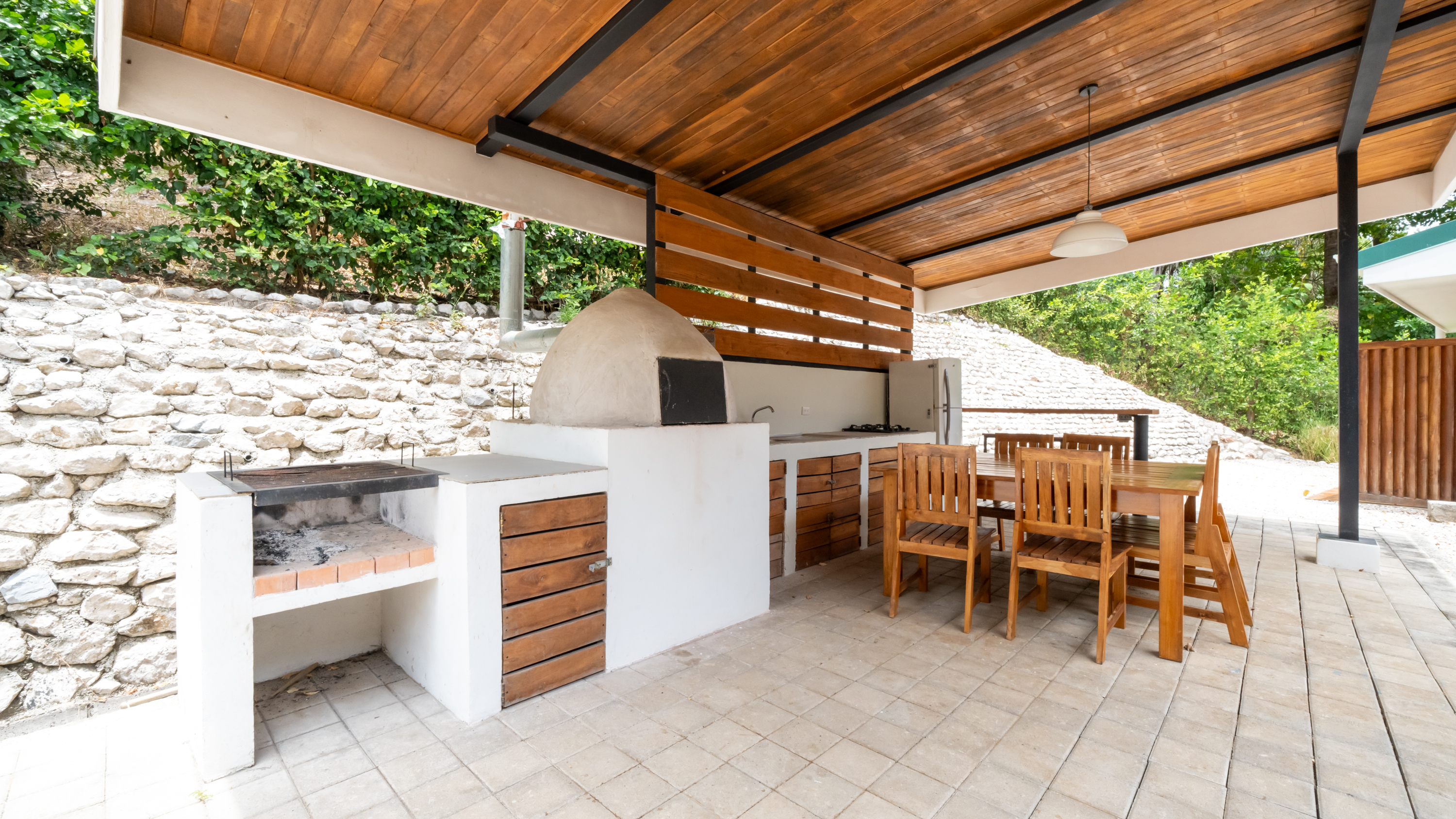 outdoor rancho kitchen and barbecue area in samara costa rica villa