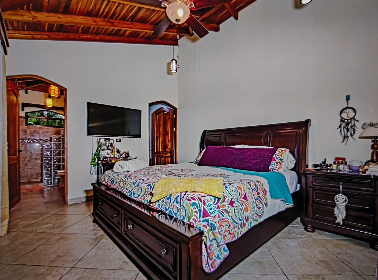 master bedroom with wood furniture villa serenity
