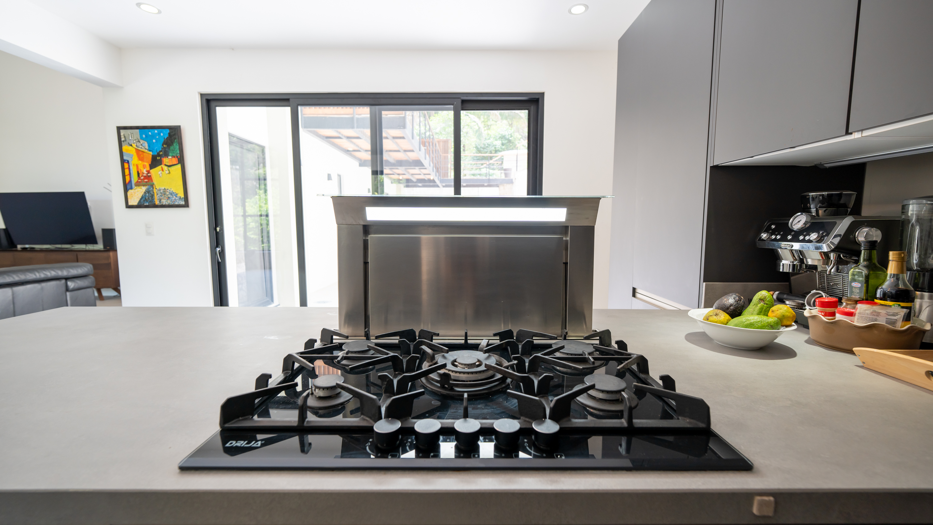 modern kitchen with island inside villa for sale in samara costa rica