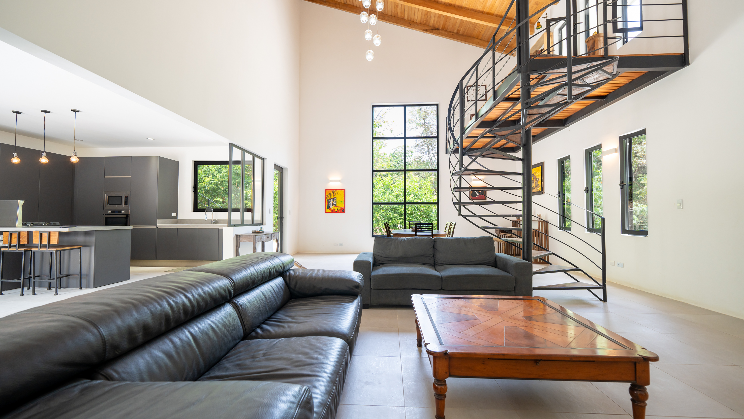 luxury living room interior with spiral staircase in samara costa rica villa